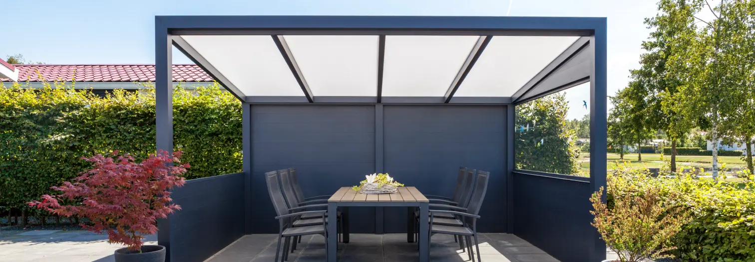 Modern outdoor patio with a sleek gazebo featuring a table and eight chairs. Vibrant plants surround, conveying a serene and inviting atmosphere