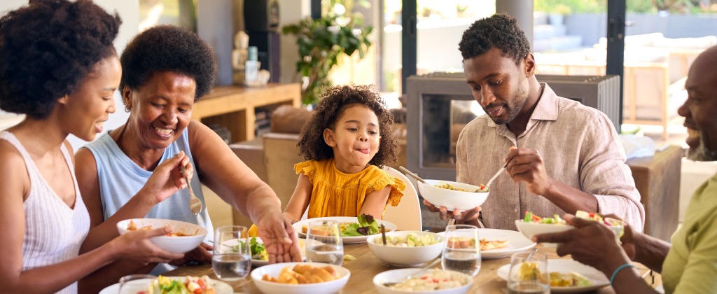 Family enjoying a meal together in a bright, comfortable home
