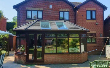 Conservatory extension with modern tiled roof improving home value and energy efficiency
