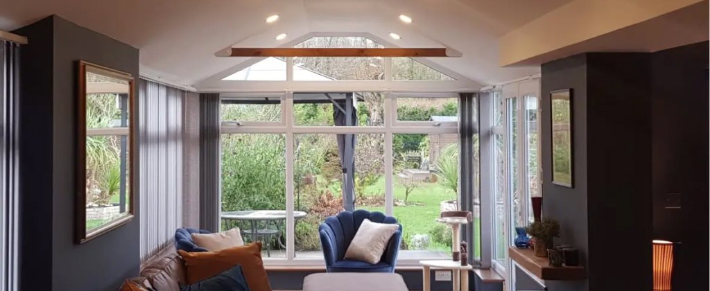 Bright conservatory interior used as a comfortable living space